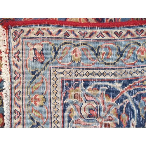 899 - A red ground Sarough rug