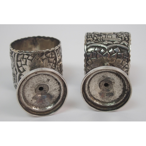9 - A pair of Chinese white metal napkin rings