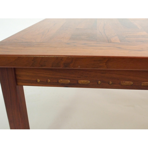 901 - A 20th Century rosewood checkerboard coffee table in the style of France & Co