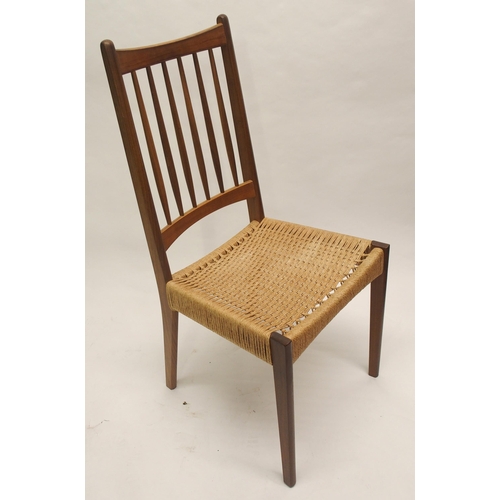 910 - Four Danish style teak spindleback dining chairs