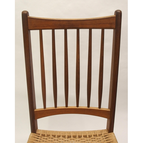 910 - Four Danish style teak spindleback dining chairs