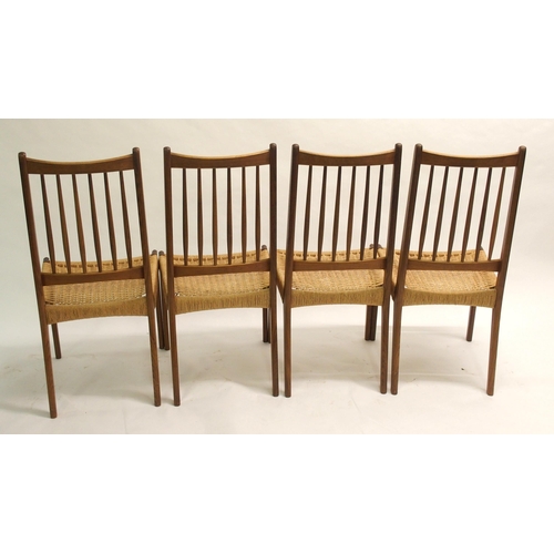 910 - Four Danish style teak spindleback dining chairs