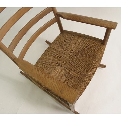 917 - A Danish ash ladder-back rocking chair