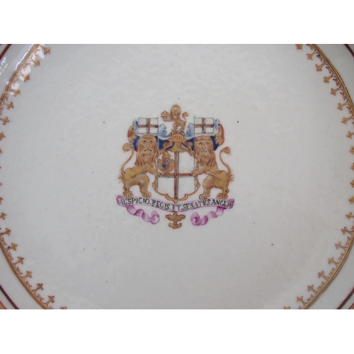 101 - A pair of Chinese export armorial circular dishes