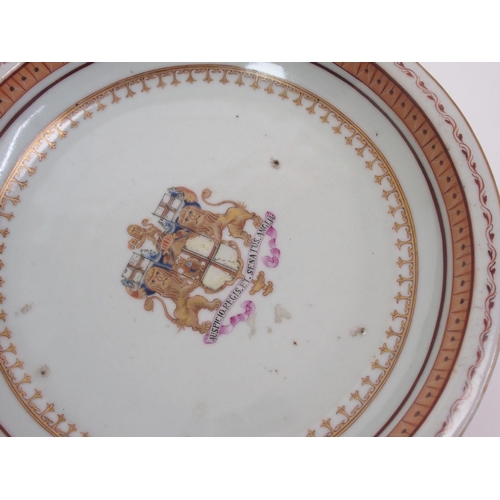 101 - A pair of Chinese export armorial circular dishes