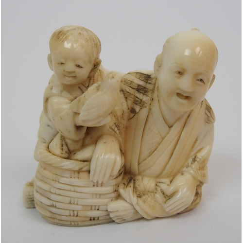 108 - A Japanese okimono with a seated man and child