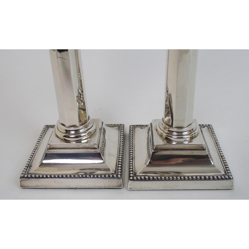 130 - A pair of silver candlesticks