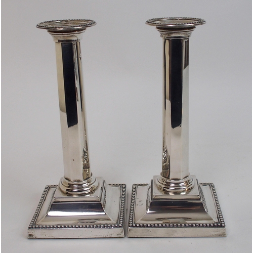 130 - A pair of silver candlesticks