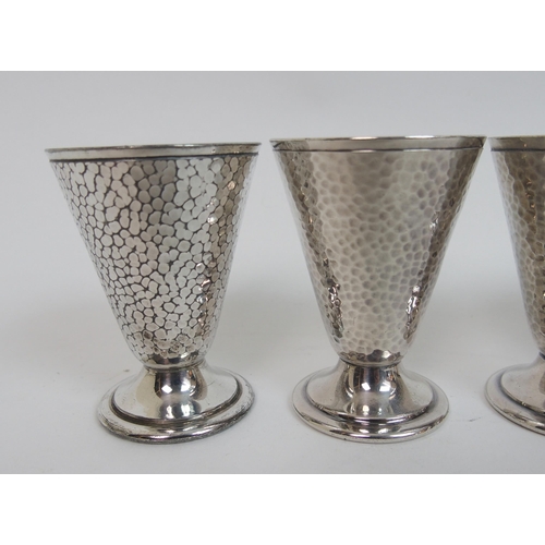 131 - A set of six white metal tot cups