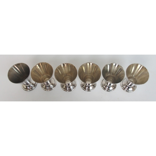 131 - A set of six white metal tot cups