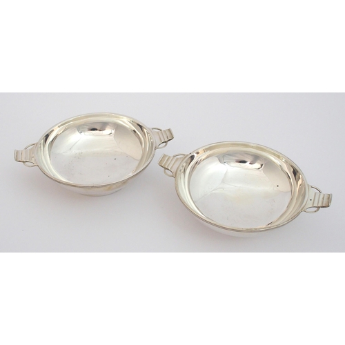 140 - A pair of silver quaichs