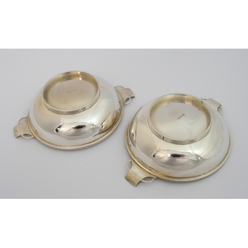 140 - A pair of silver quaichs