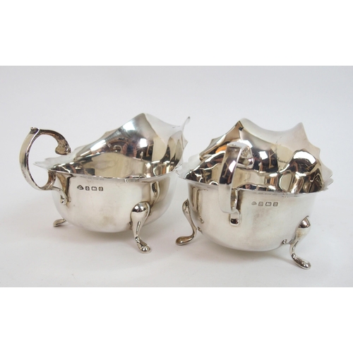 141 - A pair of silver sauceboats