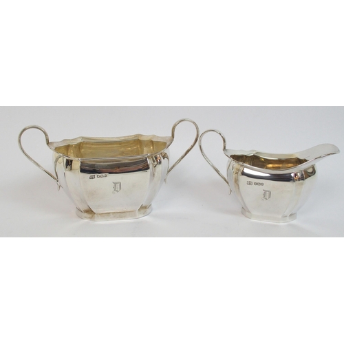 144 - A three piece silver tea service