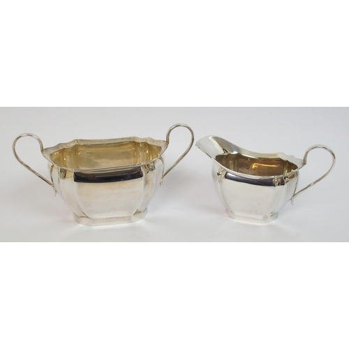 144 - A three piece silver tea service