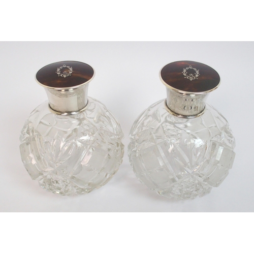 147 - A pair of silver topped scent bottles