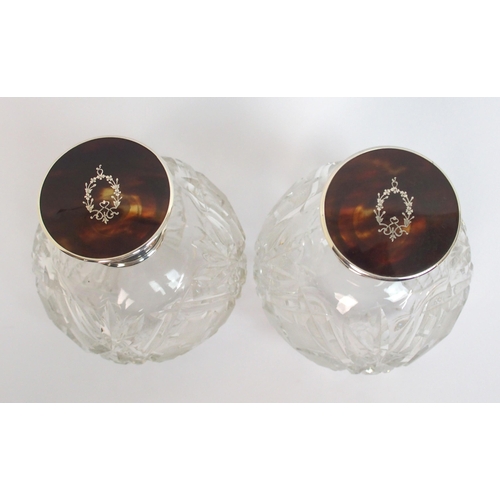 147 - A pair of silver topped scent bottles