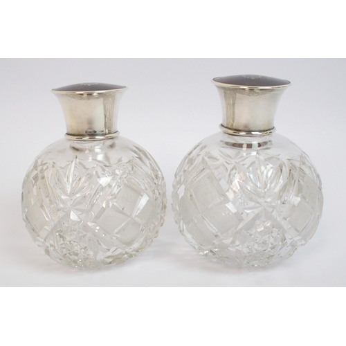 147 - A pair of silver topped scent bottles