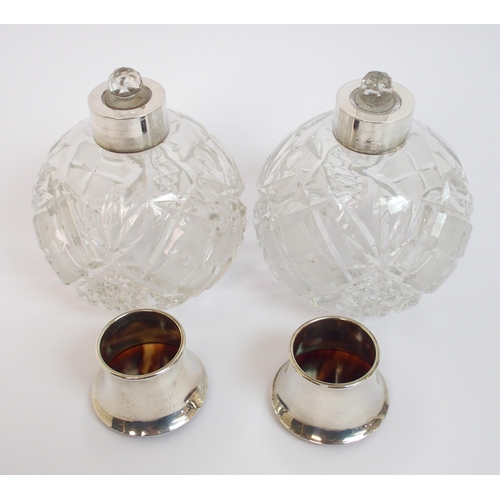 147 - A pair of silver topped scent bottles