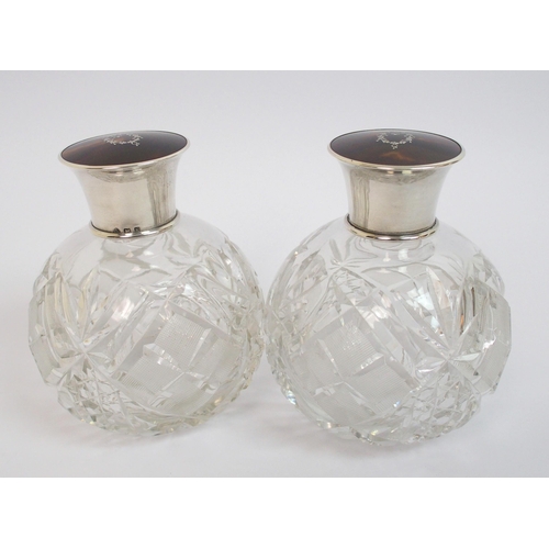 147 - A pair of silver topped scent bottles