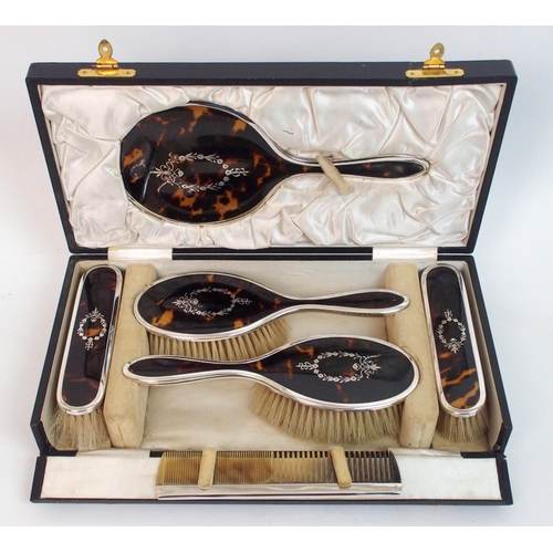 148 - A six piece silver and tortoiseshell dressing table set