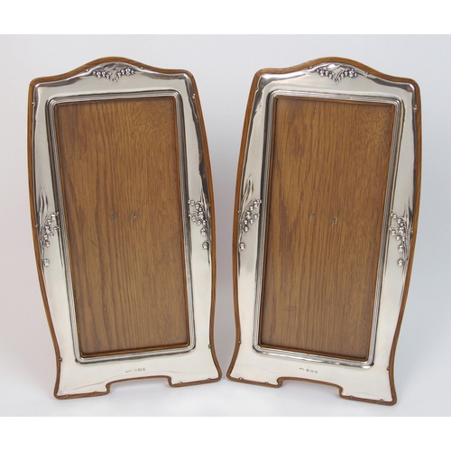 154 - A pair of Art Nouveau silver mounted photo frames