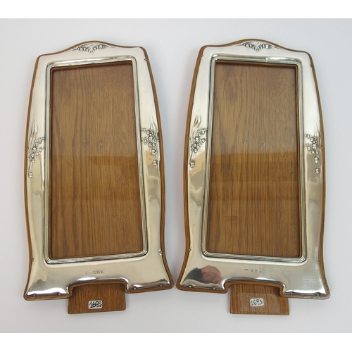 154 - A pair of Art Nouveau silver mounted photo frames