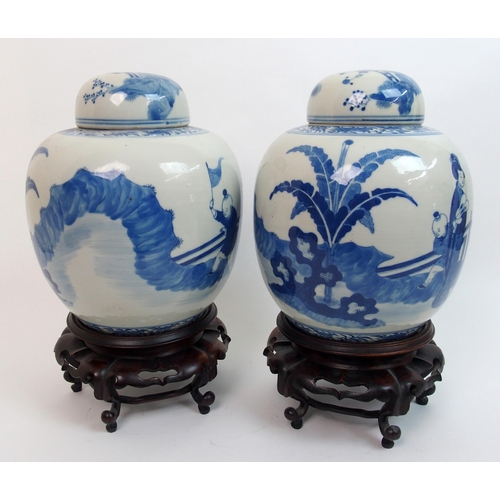 17 - A pair of Chinese blue and white ginger jars and domed covers