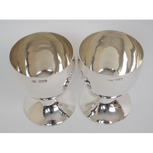 182 - A matched pair of silver goblets