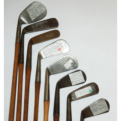 374 - A collection of sixteen various hickory-shafted putters and irons