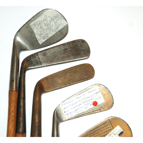 374 - A collection of sixteen various hickory-shafted putters and irons