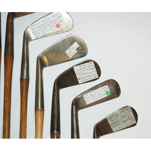 374 - A collection of sixteen various hickory-shafted putters and irons