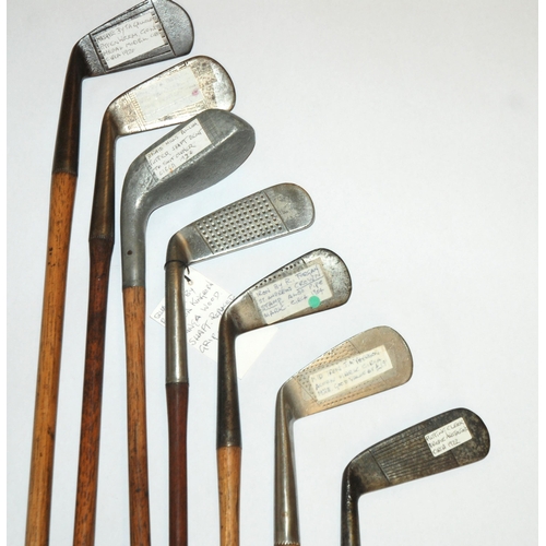 375 - A collection of fourteen various hickory-shafted putters and irons