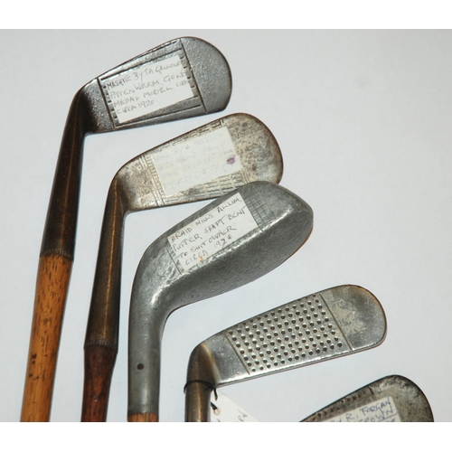 375 - A collection of fourteen various hickory-shafted putters and irons