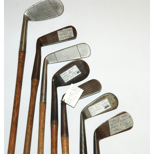 375 - A collection of fourteen various hickory-shafted putters and irons