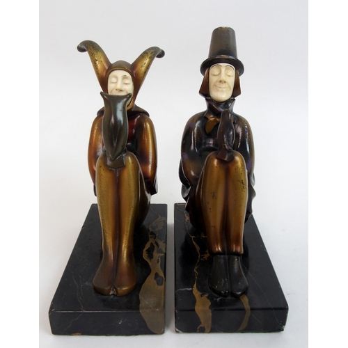 472 - Attributed to Roland Paris - a pair of cold painted bronze and ivory jester bookends