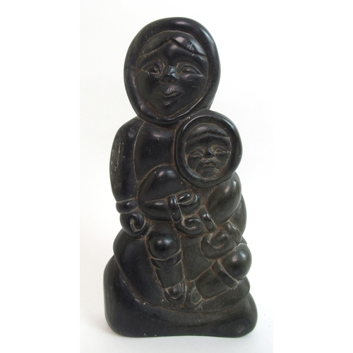 479 - An Inuit carved soapstone sculpture of a mother and child