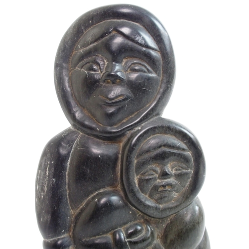 479 - An Inuit carved soapstone sculpture of a mother and child