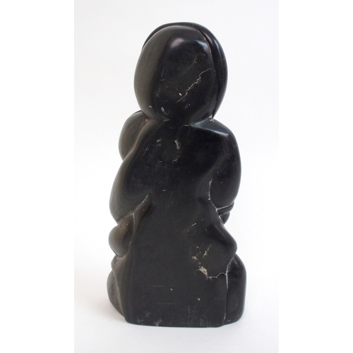 479 - An Inuit carved soapstone sculpture of a mother and child