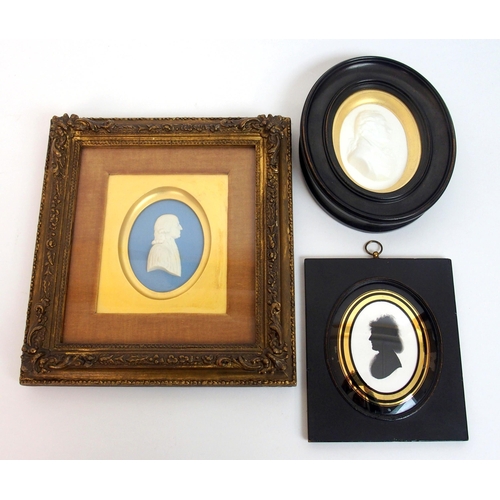 480 - A framed Wedgwood blue jasper plaque depicting a portrait of John Wesley