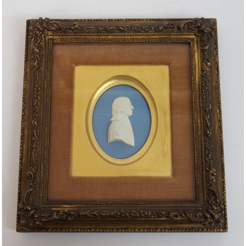 480 - A framed Wedgwood blue jasper plaque depicting a portrait of John Wesley