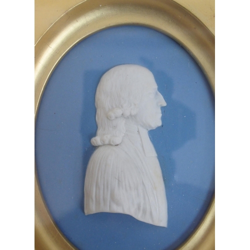 480 - A framed Wedgwood blue jasper plaque depicting a portrait of John Wesley