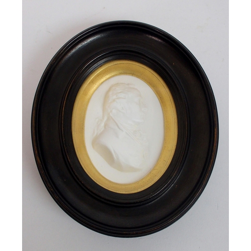 480 - A framed Wedgwood blue jasper plaque depicting a portrait of John Wesley