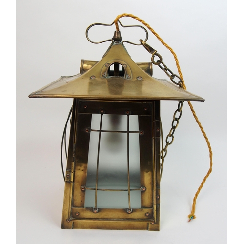 483 - An Arts and Crafts brass hall lantern