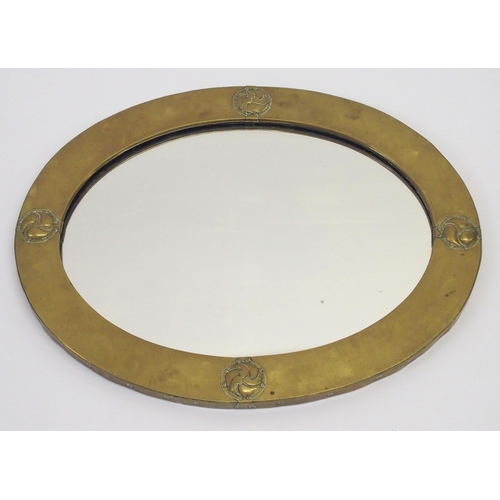 484 - A Liberty design Arts and Crafts brass framed mirror