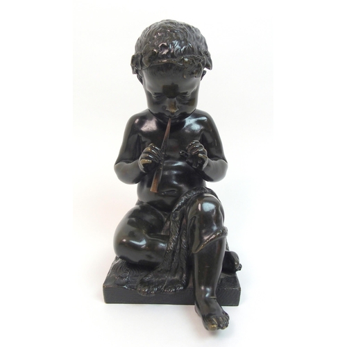 493 - A 20th Century bronze of a small boy playing a pipe