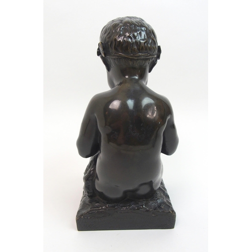 493 - A 20th Century bronze of a small boy playing a pipe