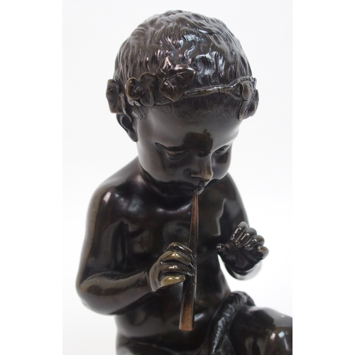 493 - A 20th Century bronze of a small boy playing a pipe