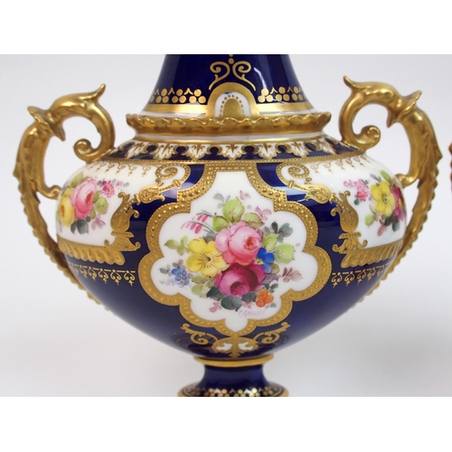 501 - A pair of Royal Crown Derby urns and covers