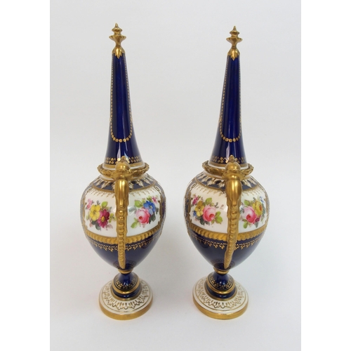 501 - A pair of Royal Crown Derby urns and covers